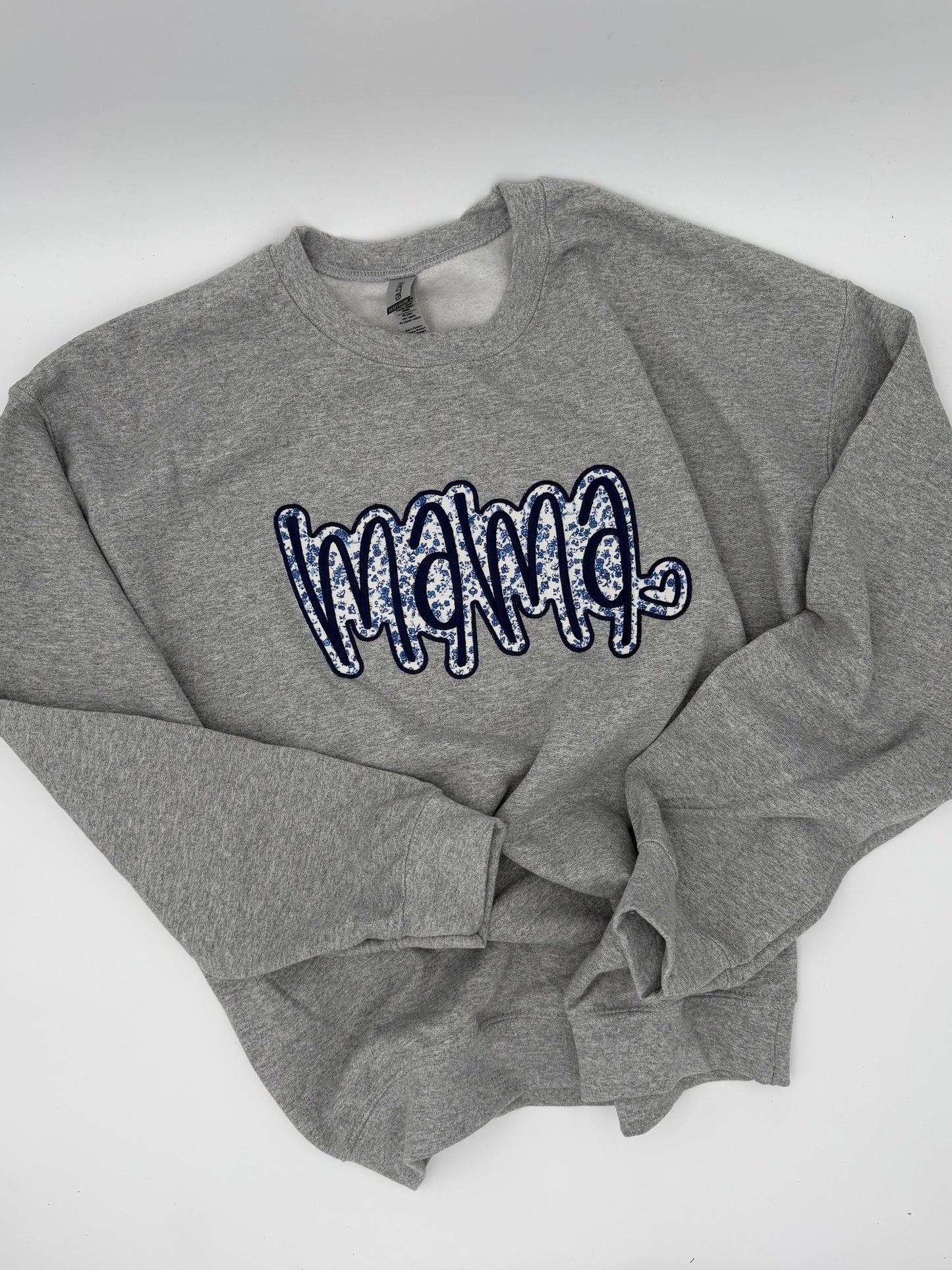 blue and white floral pattern on gray sweatshirt