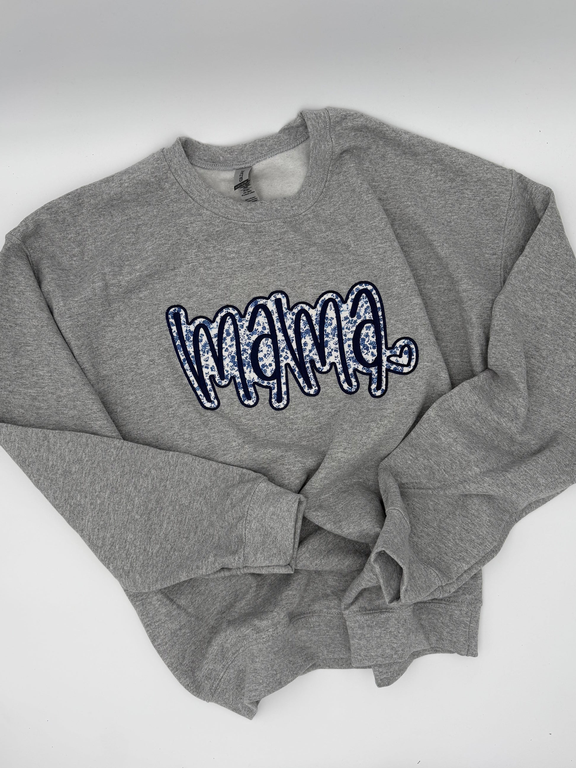 blue and white floral pattern on gray sweatshirt